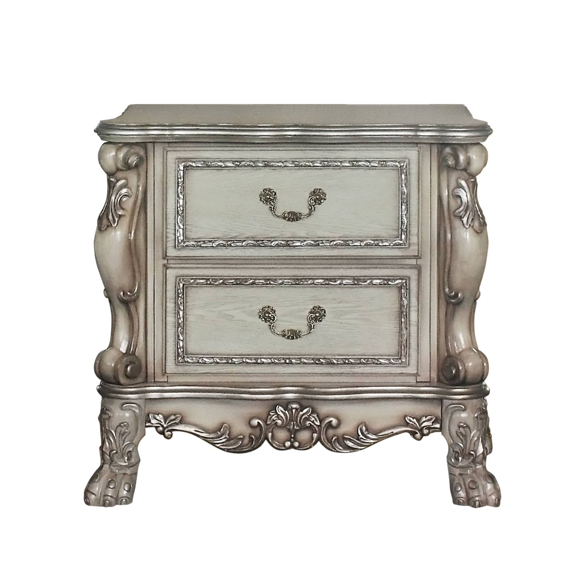 Ornate twodrawer antique nightstand with silver trim and claw feet
