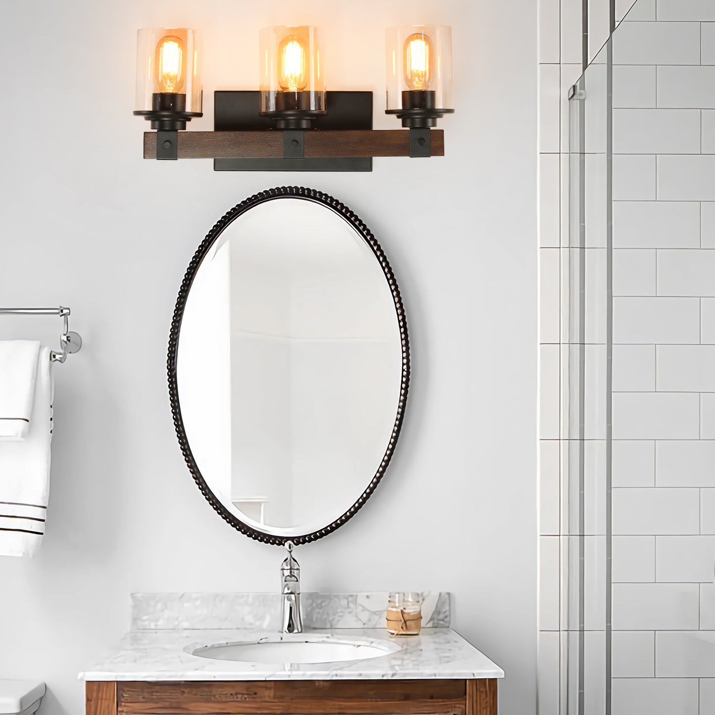 Rustic threelight vanity light with dark wood and black metal accents