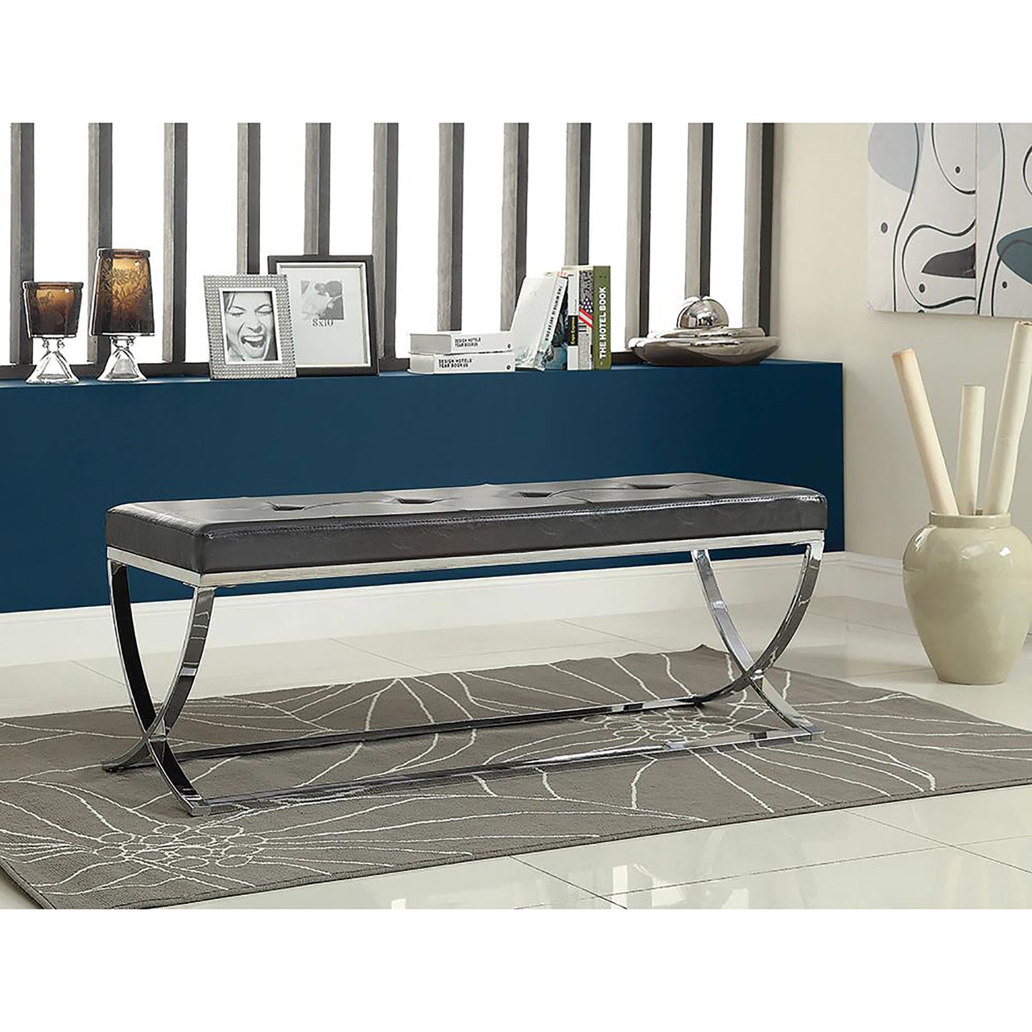 Dark brown faux leather bench with tufted top and chrome legs