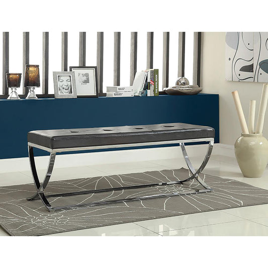Dark brown faux leather bench with tufted top and chrome legs