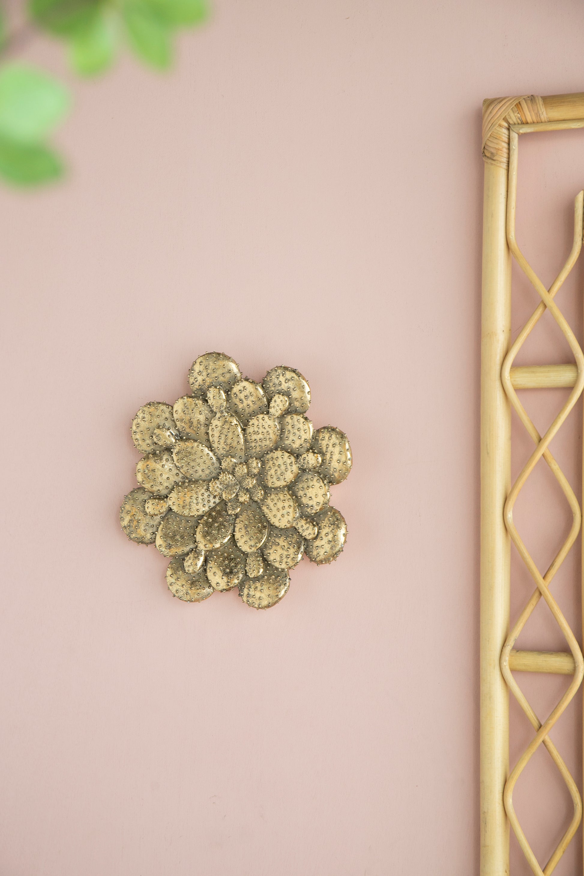 Antique brass cactus wall art with detailed textures adding desert charm to any room