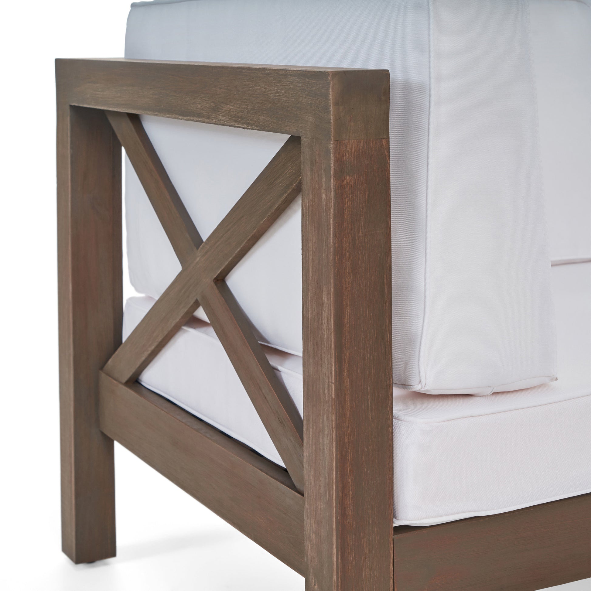Rustic brown wood armchair with white cushions featuring an Xbrace design on the armrest for outdoor seating