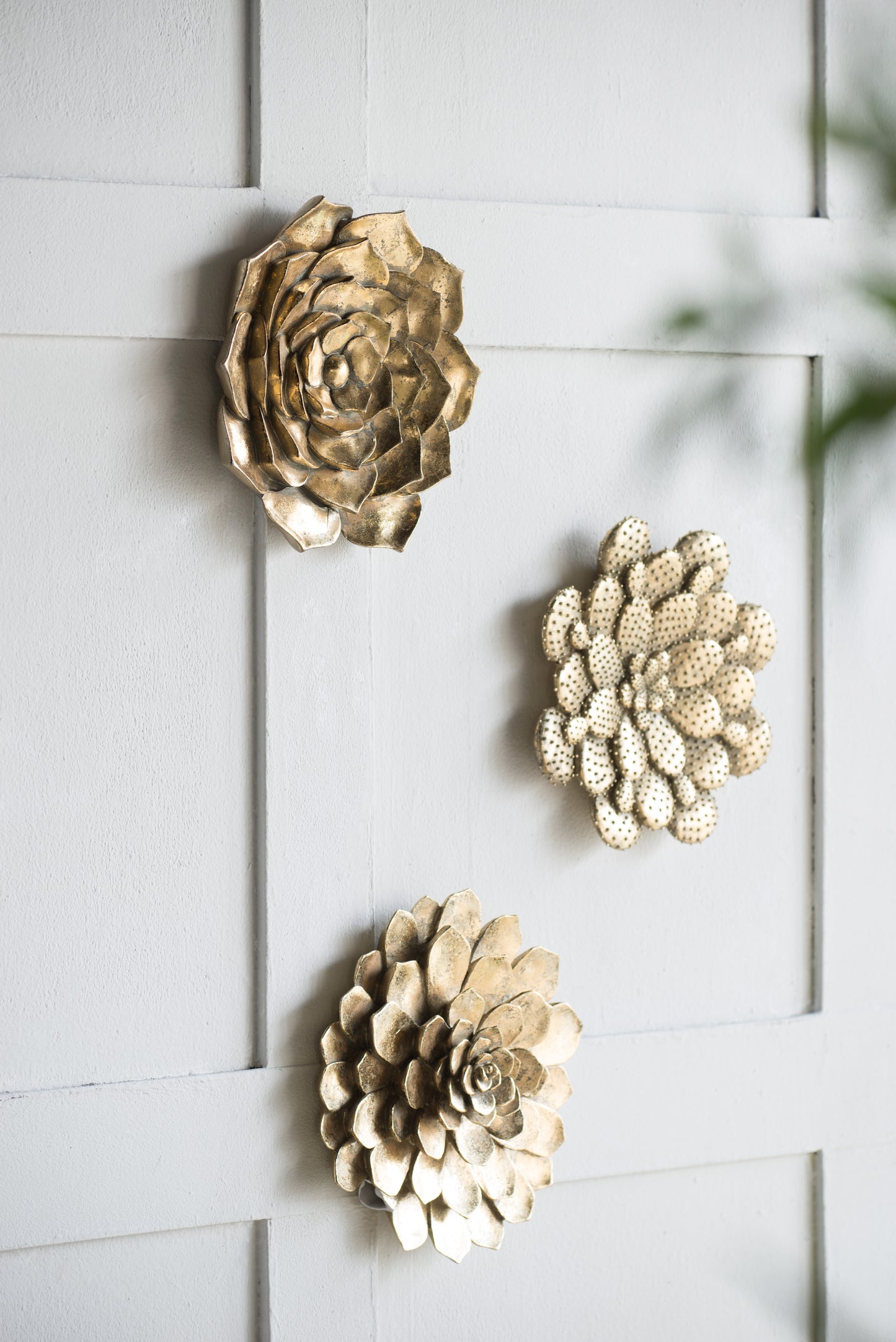 Set of  gold metal floral wall art with layered petals and textured detail
