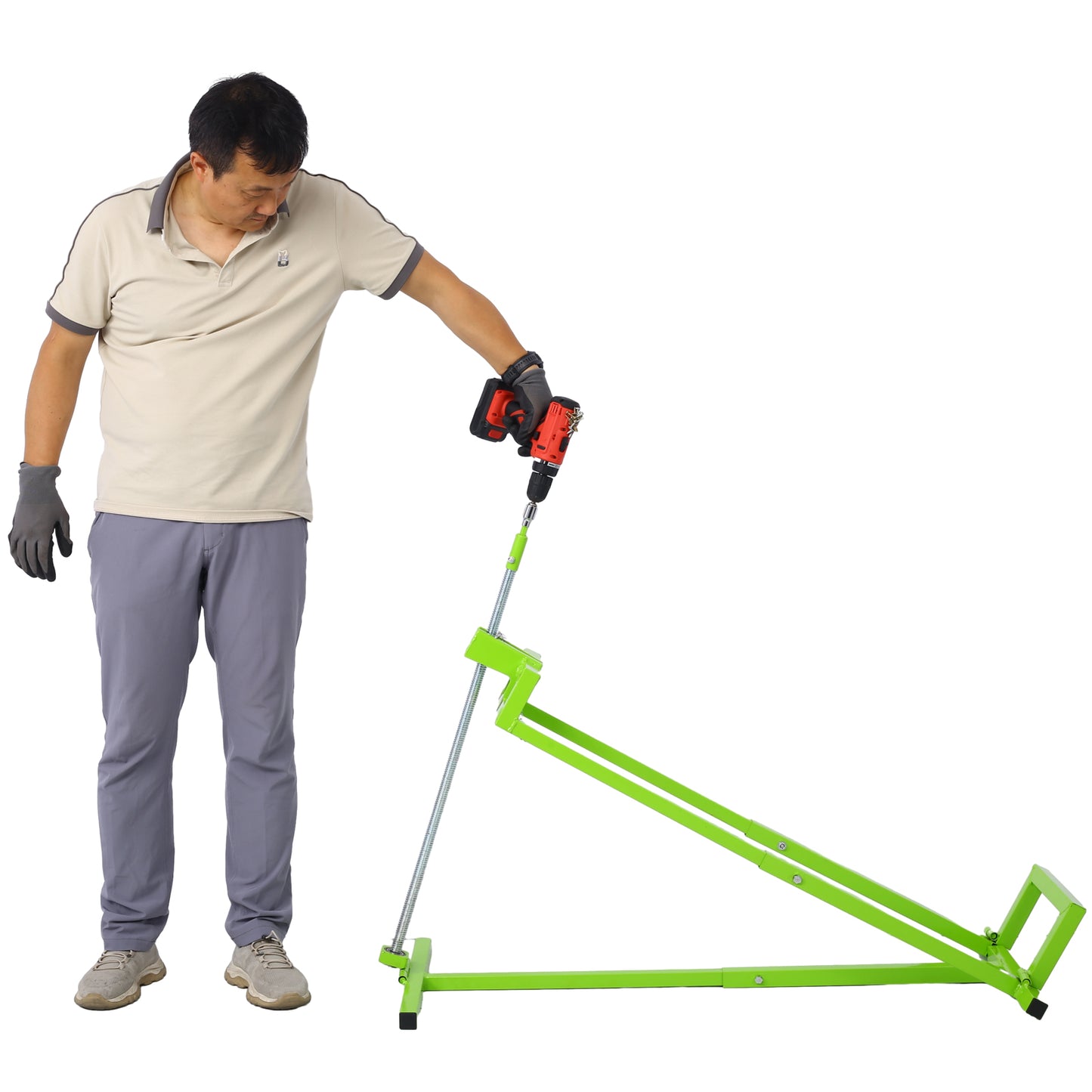 Man operating a manual pipe bender tool with a cordless drill for plumbing tasks