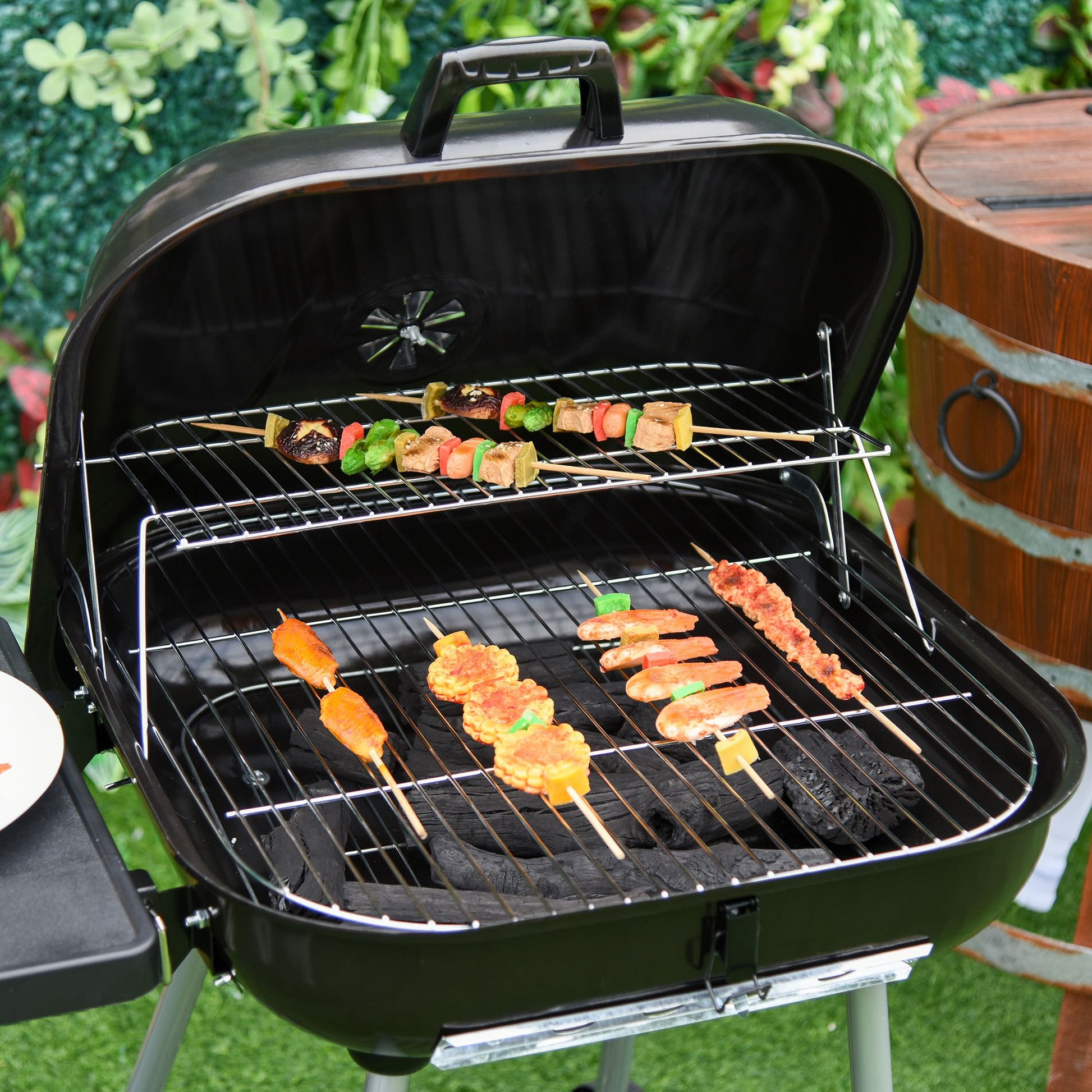 Black charcoal grill with assorted meat and vegetable skewers cooking on its grates