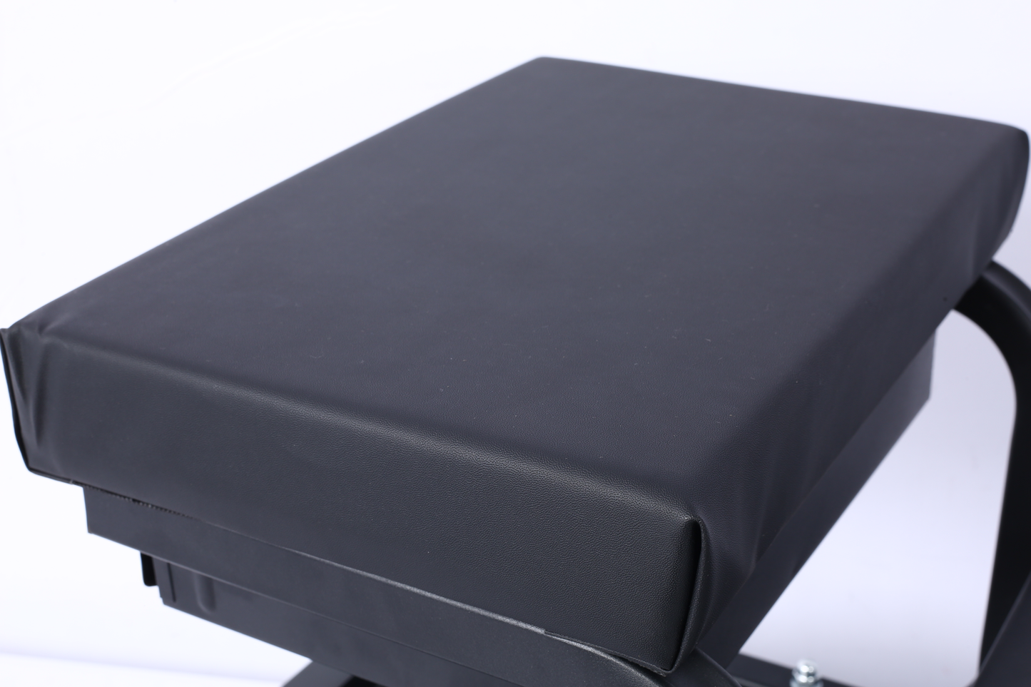 Black upholstered exercise bench with durable faux leather for home gym workouts