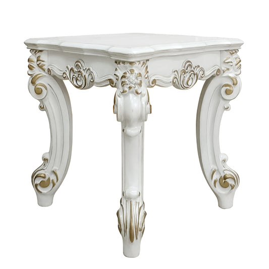 Ornate white carved side table with gold accents and cabriole legs