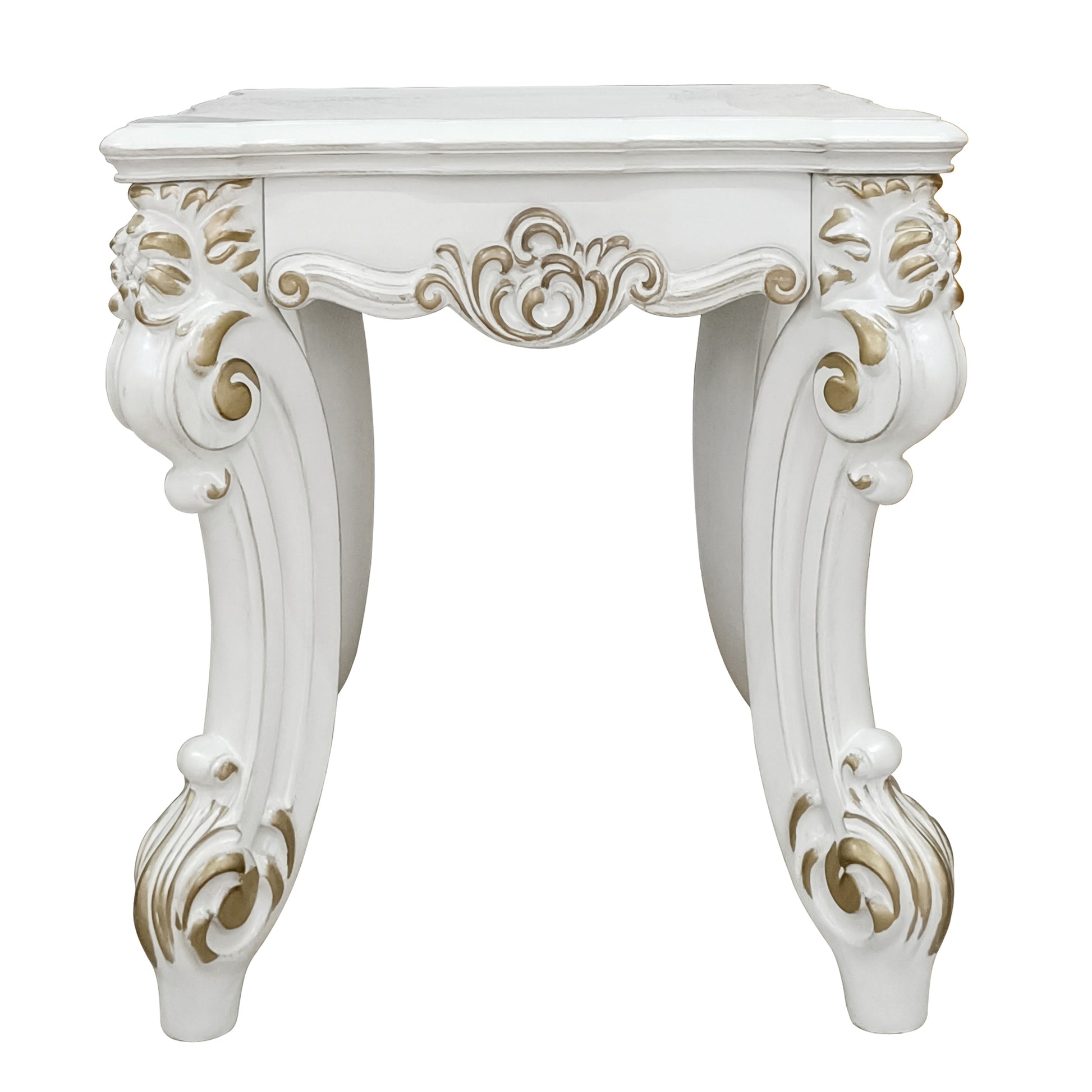 Elegant white accent table with ornate gold scrollwork and carved legs