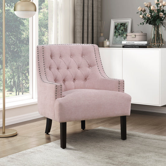 Pink upholstered accent chair with tufted back and silver nailhead trim