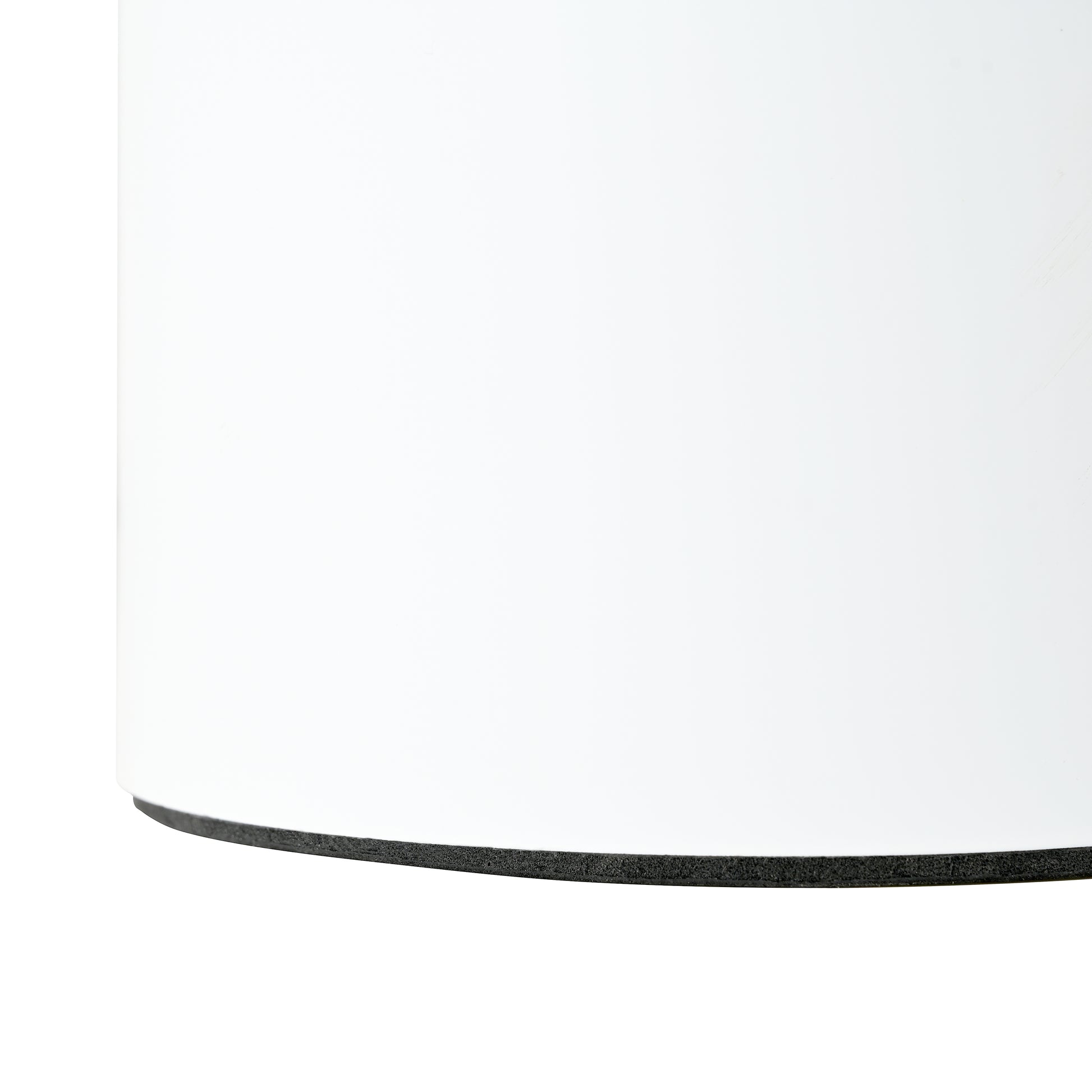 Closeup of a white cylinder base with black foam edge detail