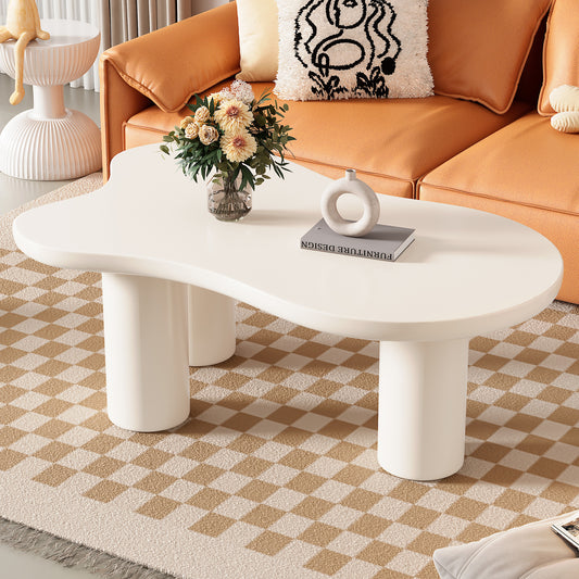 Sculptural white organic coffee table with rounded legs and a smooth matte finish