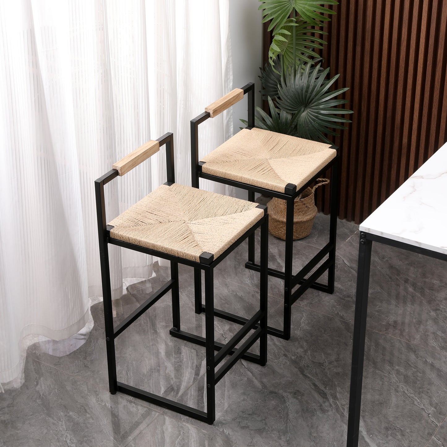 Modern bar stool with woven jute seat and natural wood armrests on black metal frame