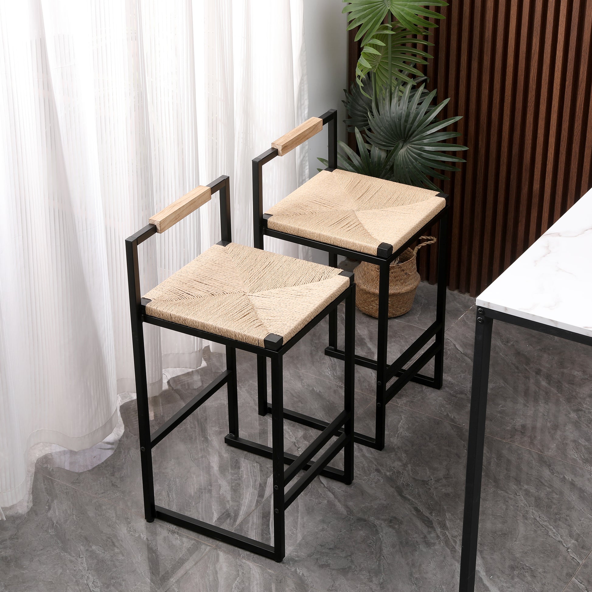 Modern bar stool with woven jute seat and natural wood armrests on black metal frame
