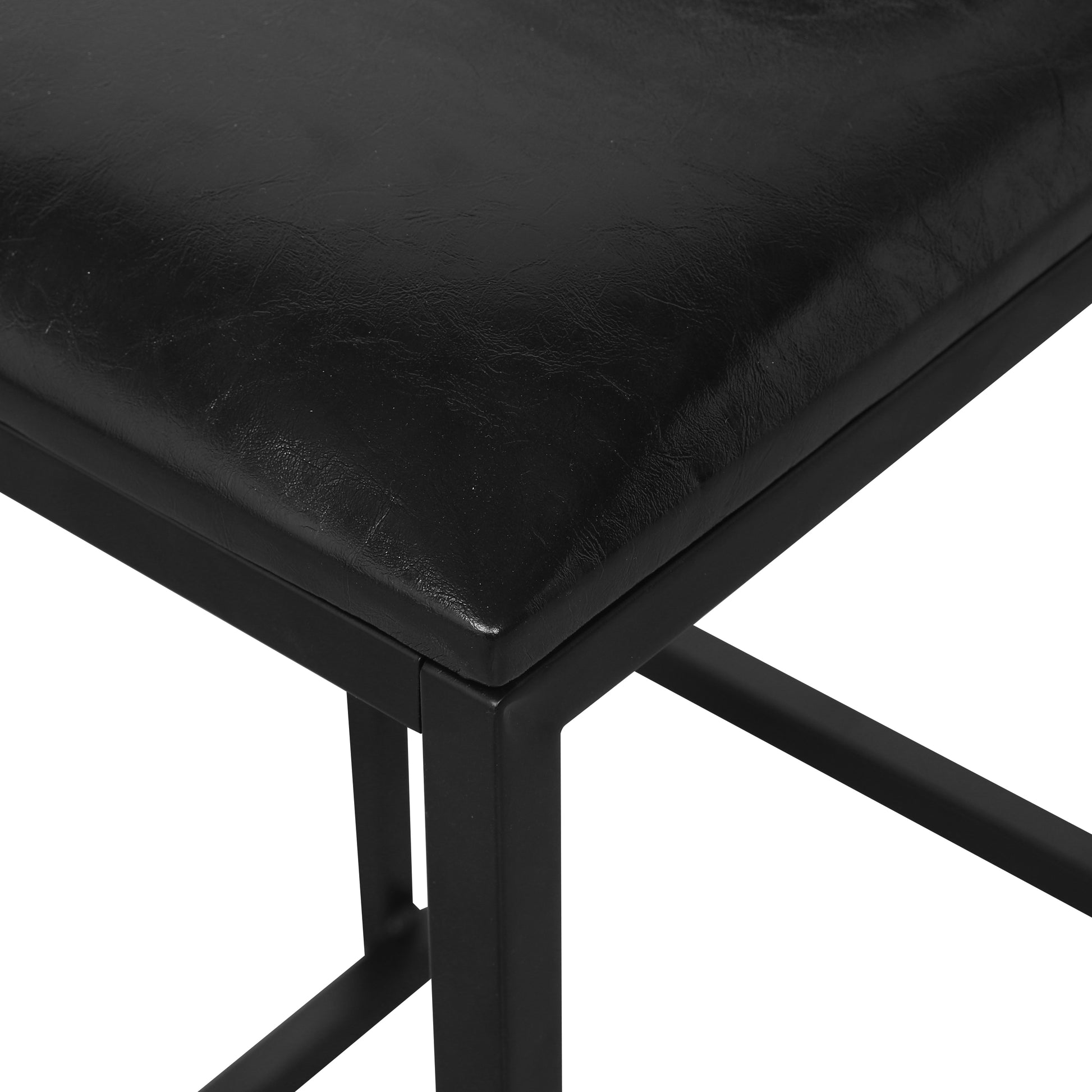 Closeup of a black faux leather seat on a metal stool frame perfect for a modern kitchen