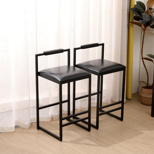 Two black faux leather bar stools with metal frames and armrests