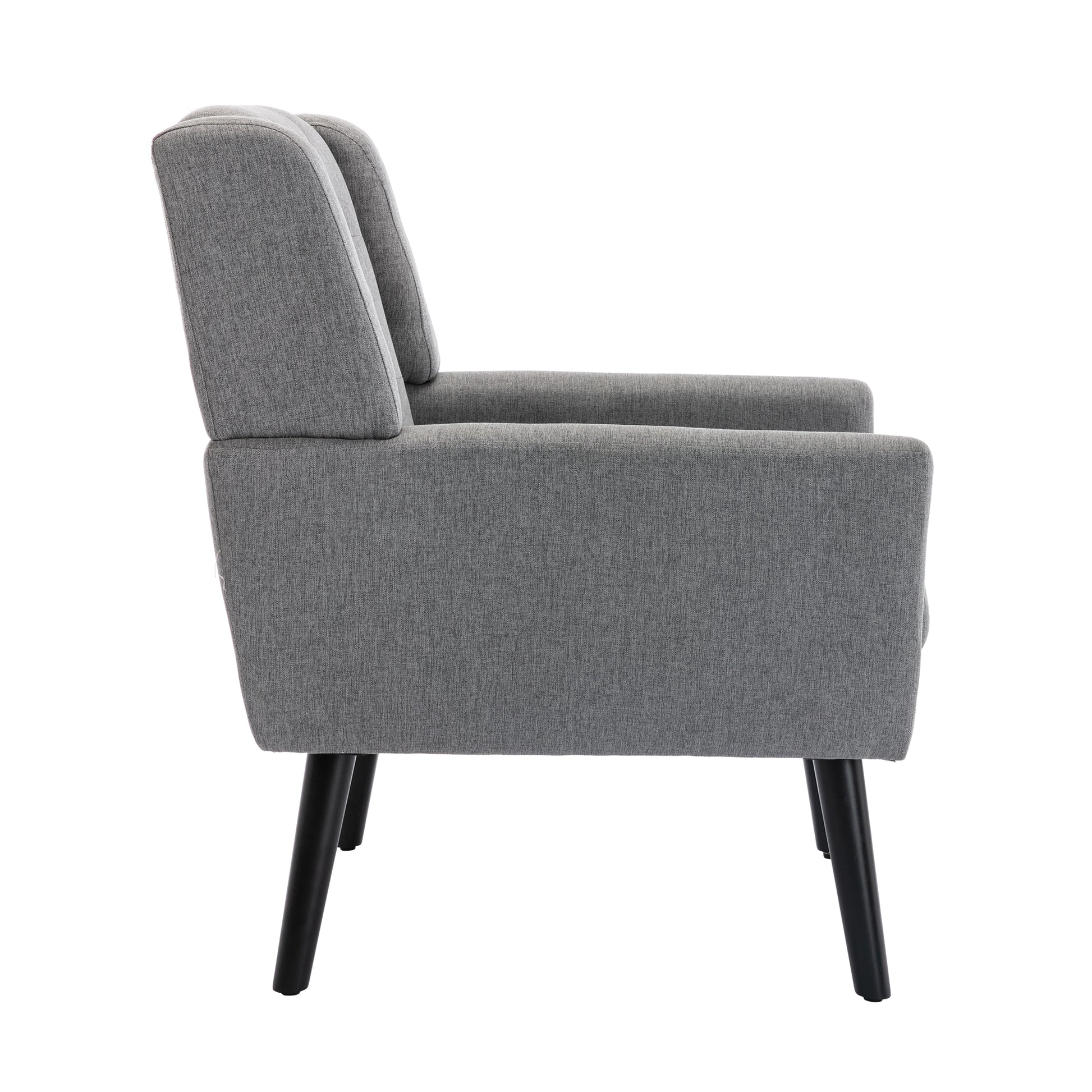 Gray upholstered accent chair with tapered black legs a modern addition