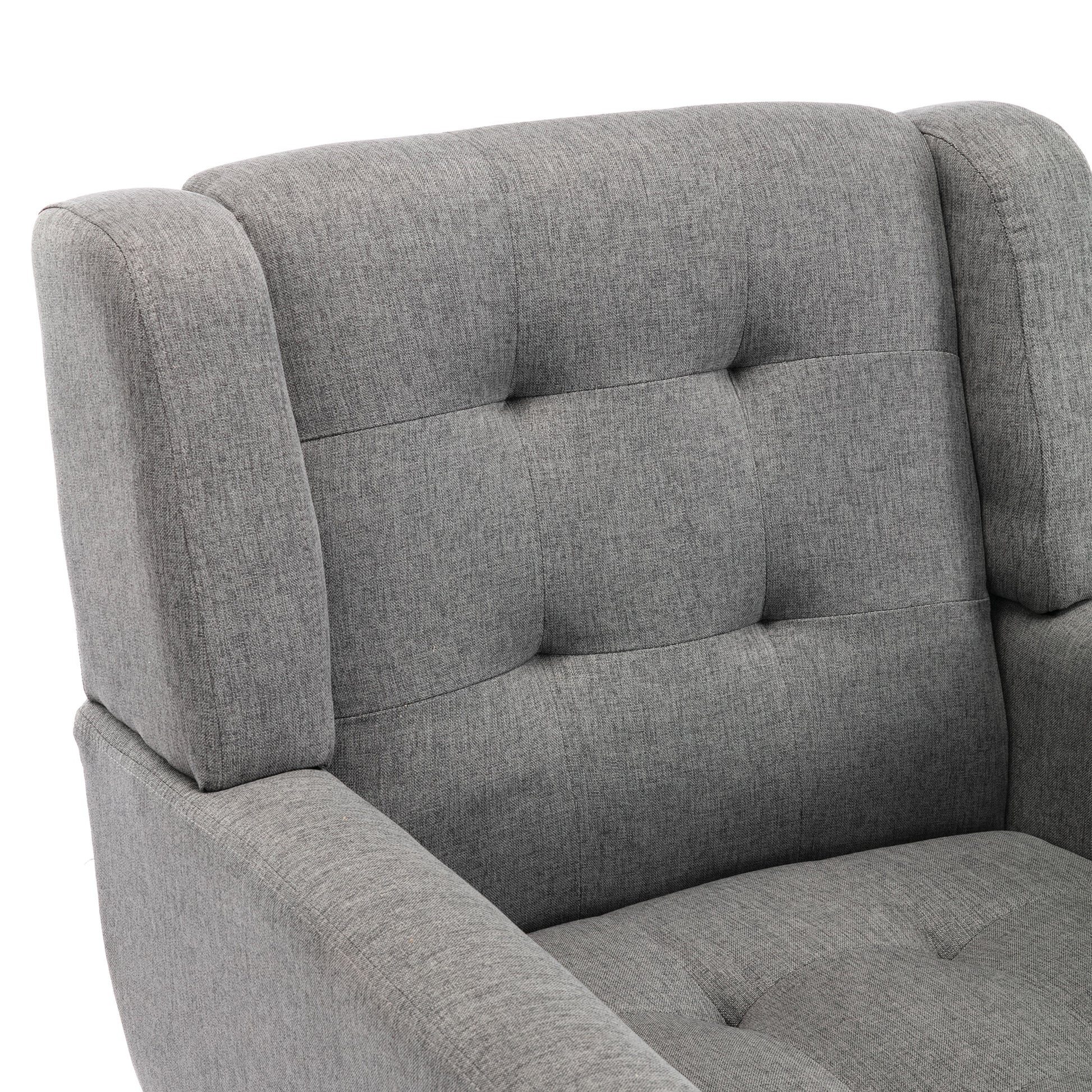 Closeup of a grey fabric recliner with button tufting on the backrest and rolled arms