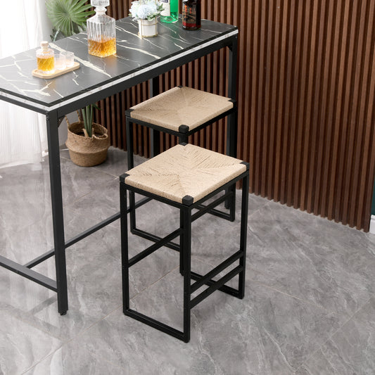 Black metal bar stool with woven jute seat perfect for modern kitchens