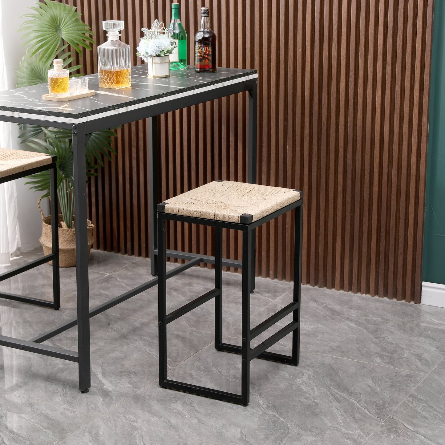 Woven rope seat bar stool with a black metal frame perfect for a modern kitchen island