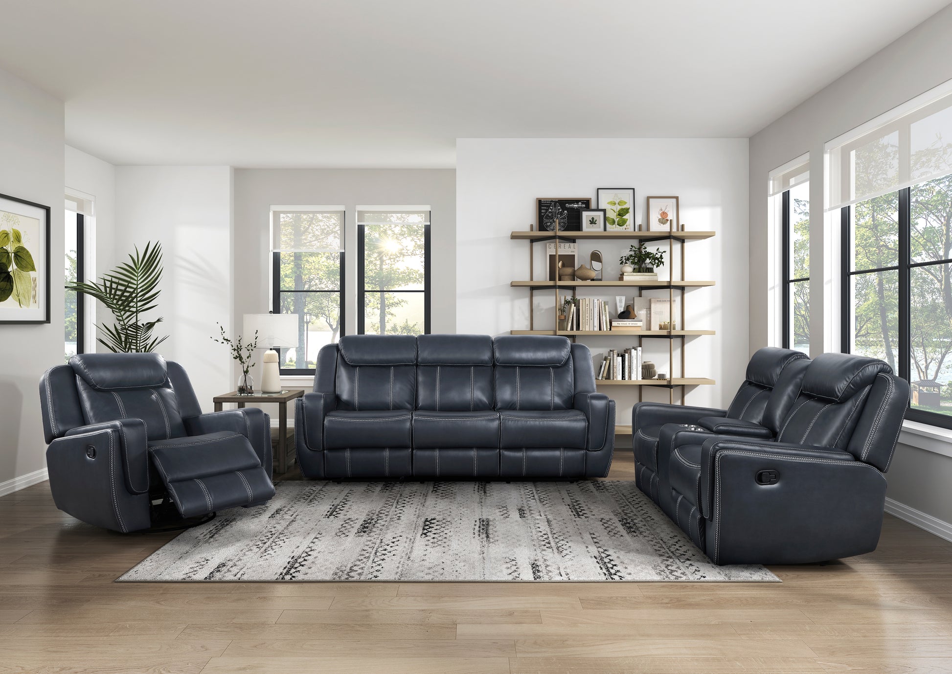 Dark navy leather reclining sofa with white stitching set in a modern living room