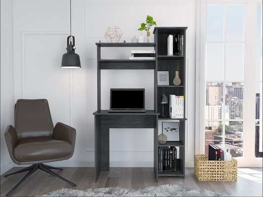 Dark gray modern computer desk with attached shelving and a laptop