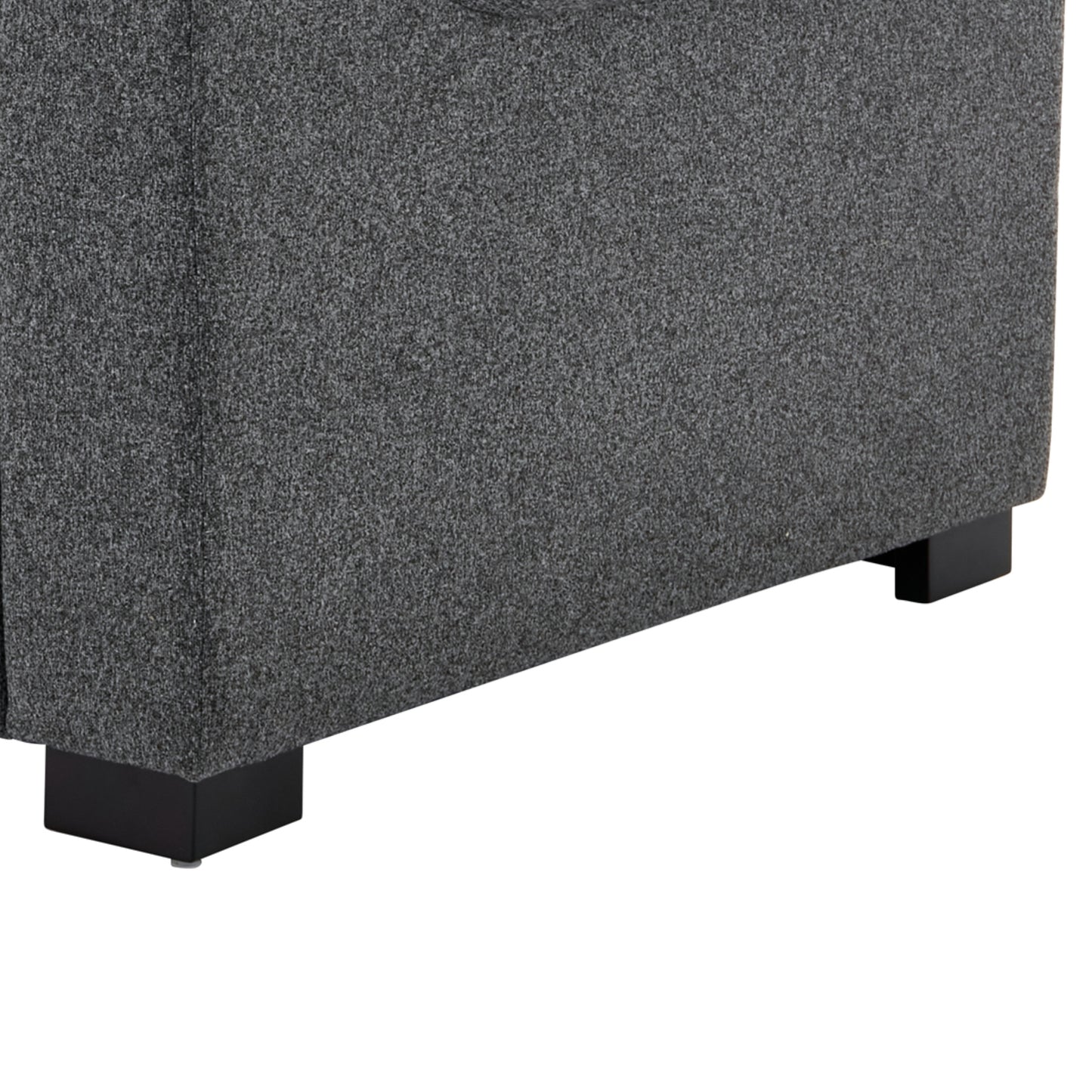 Closeup of textured dark gray fabric upholstery on a modern sofas base