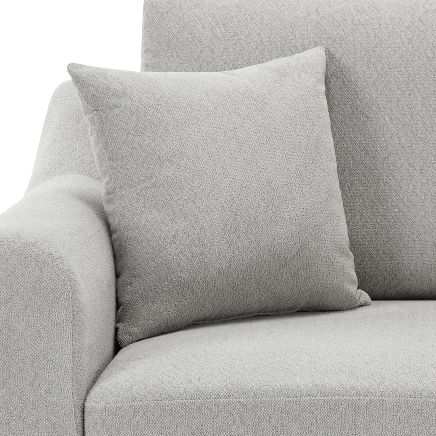 Light grey textured throw pillow on a matching sofa offering comfort and style