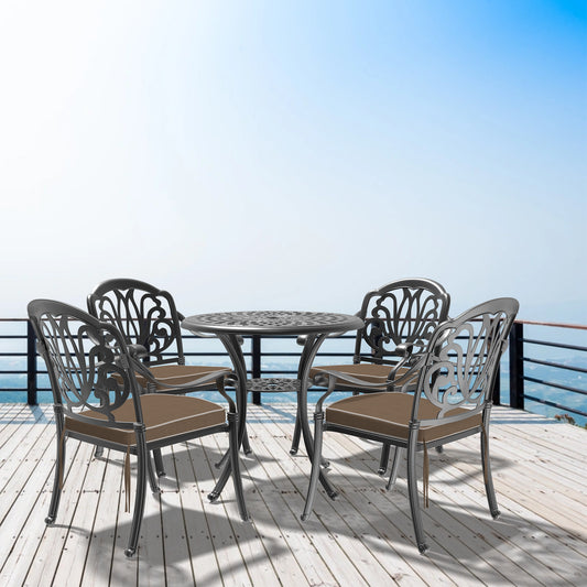 Ornate metal patio dining set with four chairs and round table