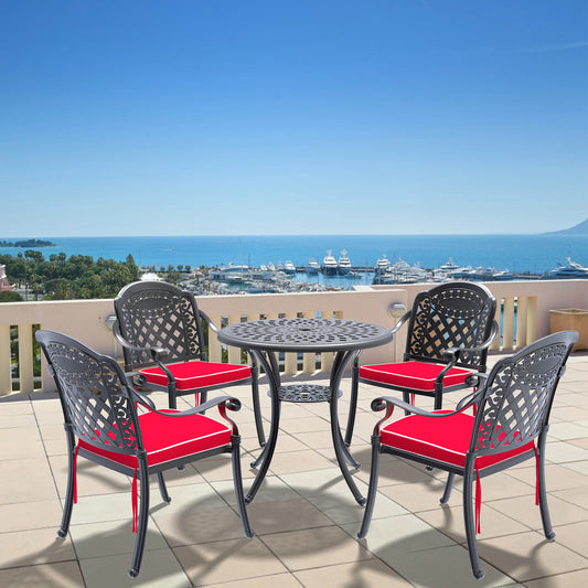 Ornate black cast aluminum patio dining set with red cushions
