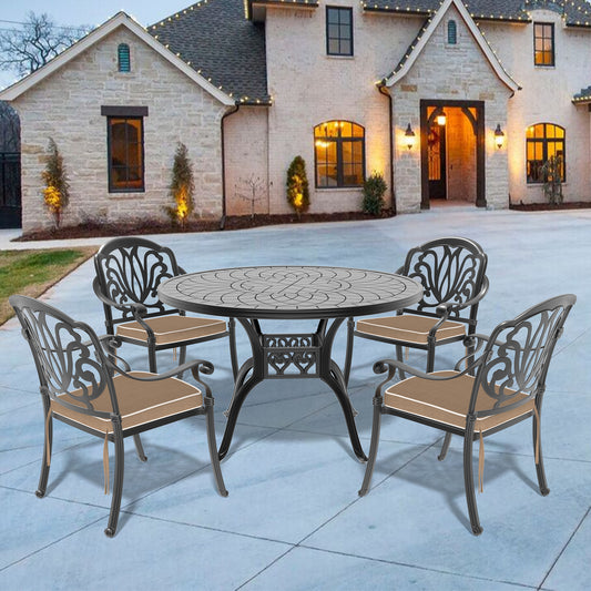 Ornate black cast aluminum patio dining set with beige cushions  table and  chairs