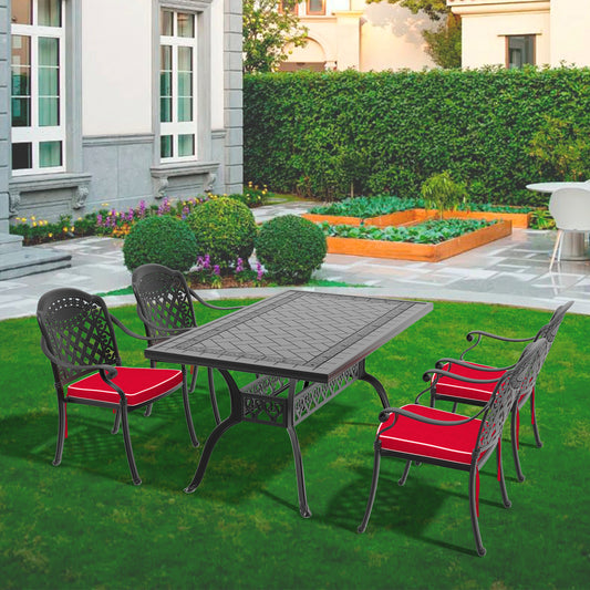 Black cast aluminum patio dining set with four chairs and red cushions