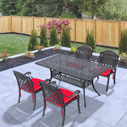 Ornate black cast aluminum patio dining set with red cushions