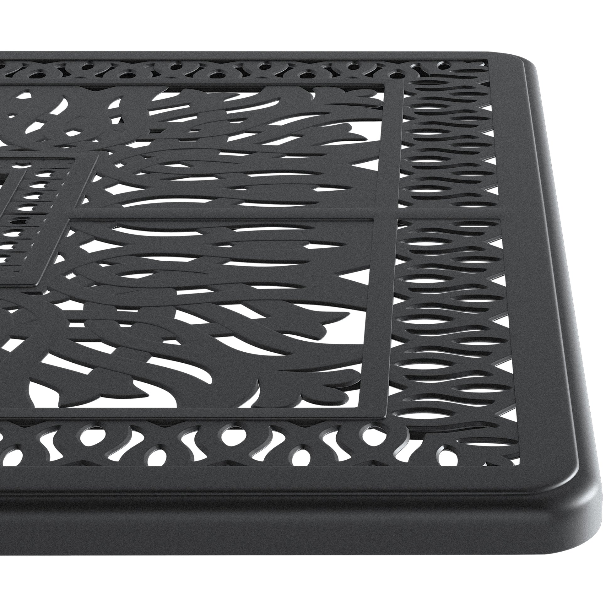 Closeup of a black ornate cast iron table top with intricate leaf pattern