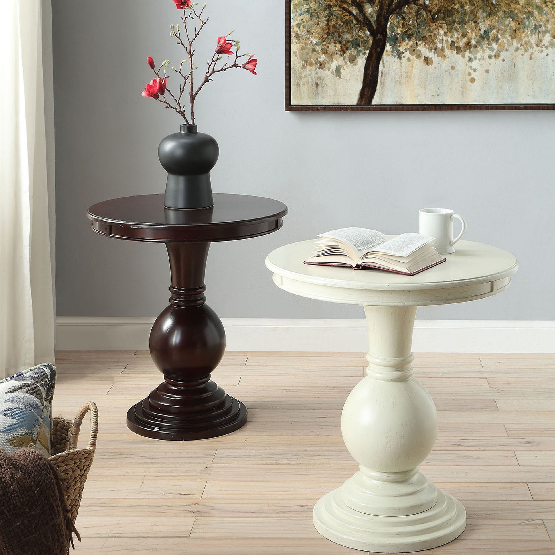 Dark cherry pedestal end table with a vase of red flowers