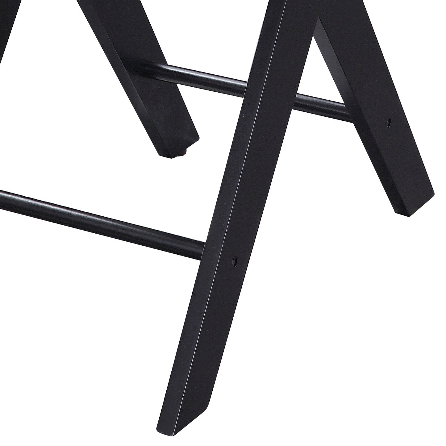 Closeup of black metal folding chair legs with crossbar detail