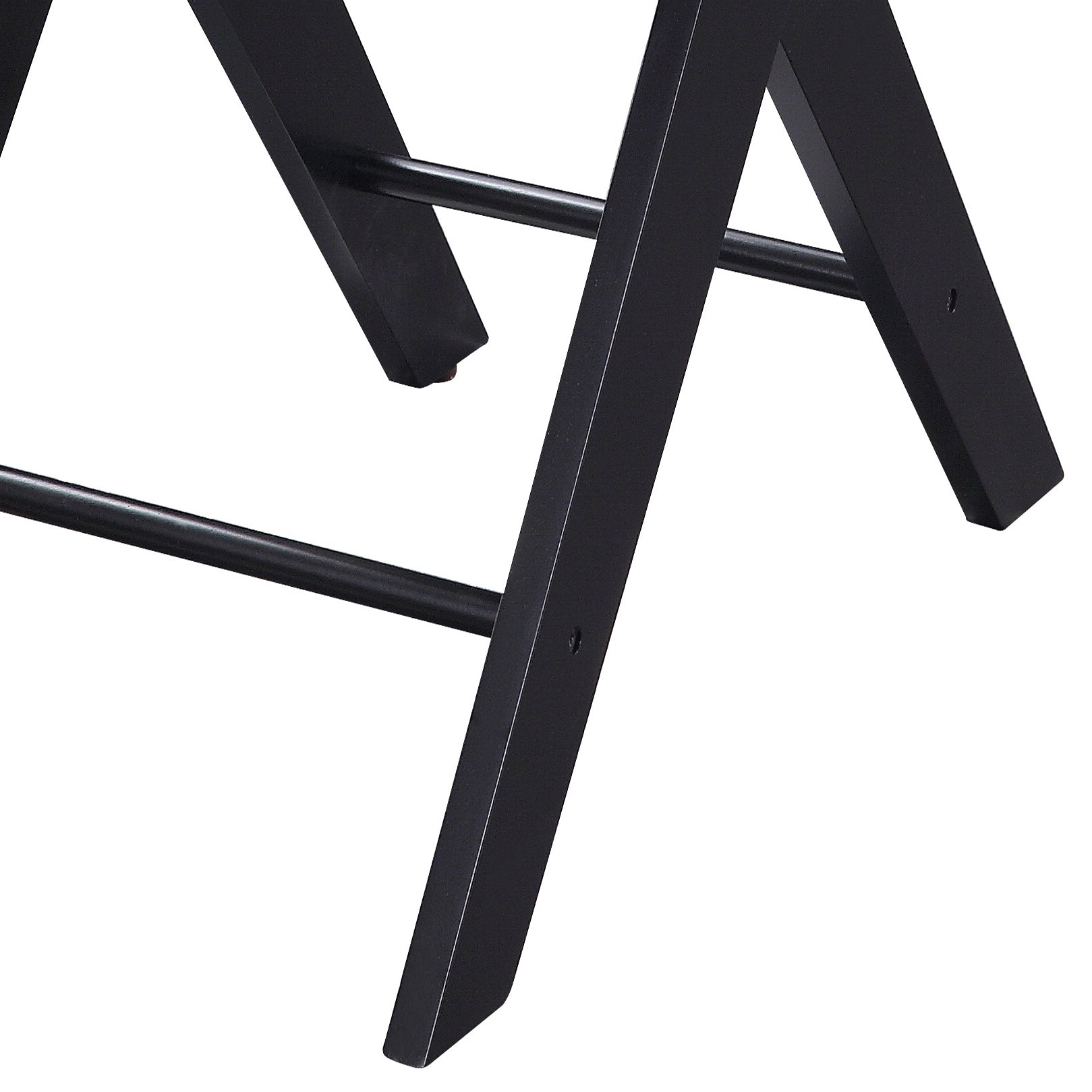 Closeup of black metal folding chair legs with crossbar detail