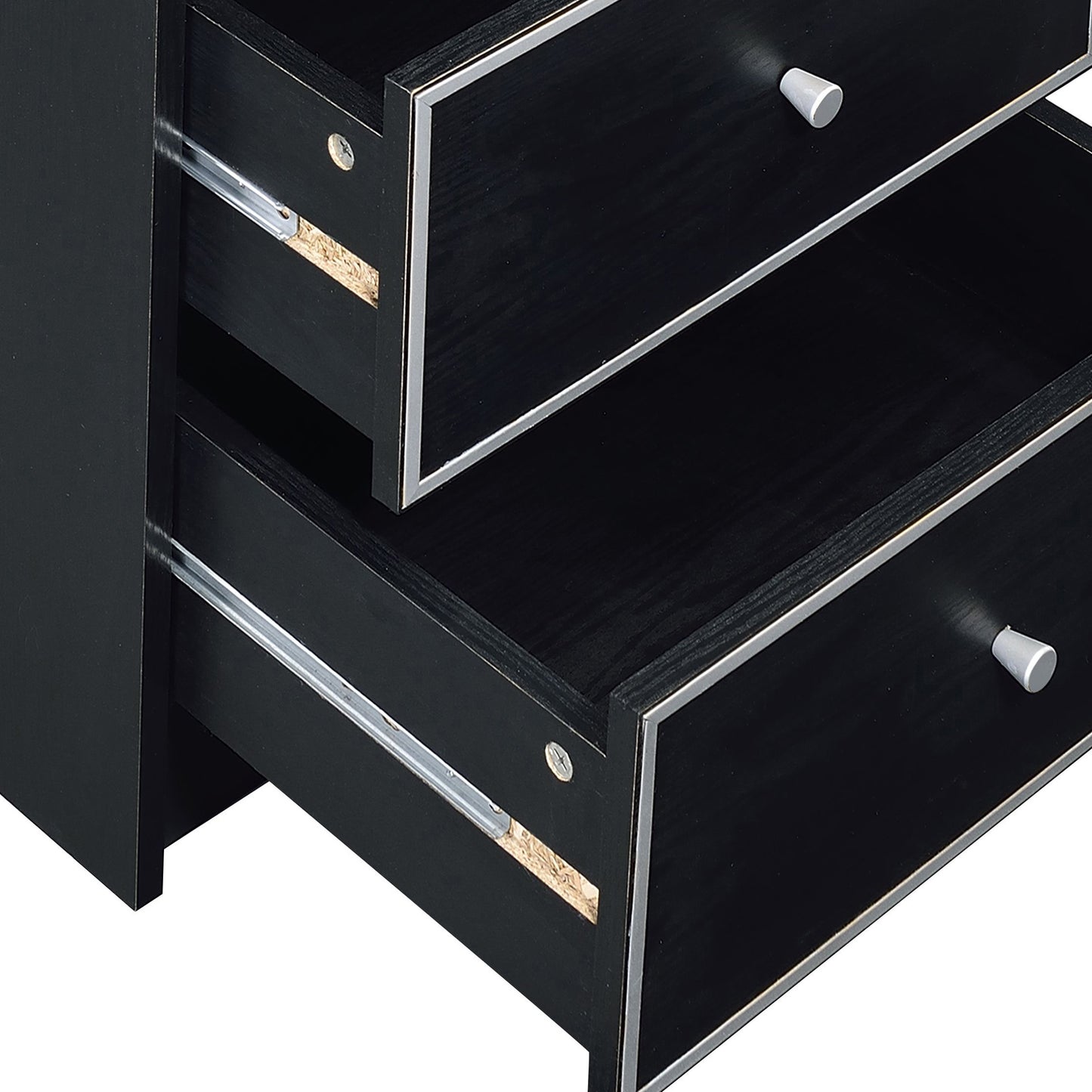 Closeup of black wooden dresser drawers with silver handles and trim showing drawer slides