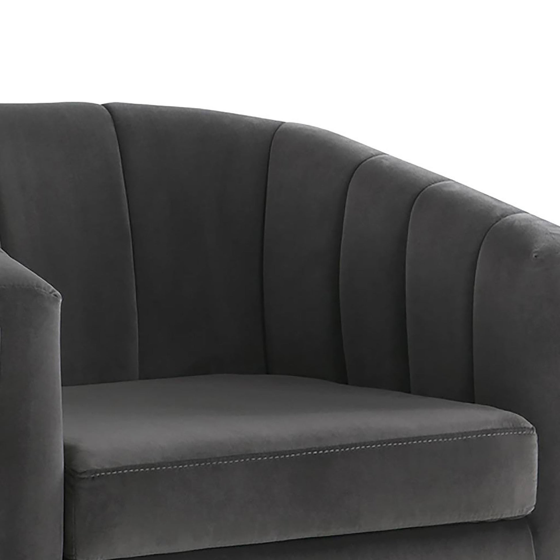 Dark grey velvet accent chair with channel tufting on back