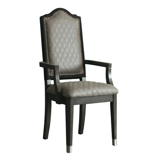 Tufted grey upholstered dining chair with dark wood frame and nailhead trim