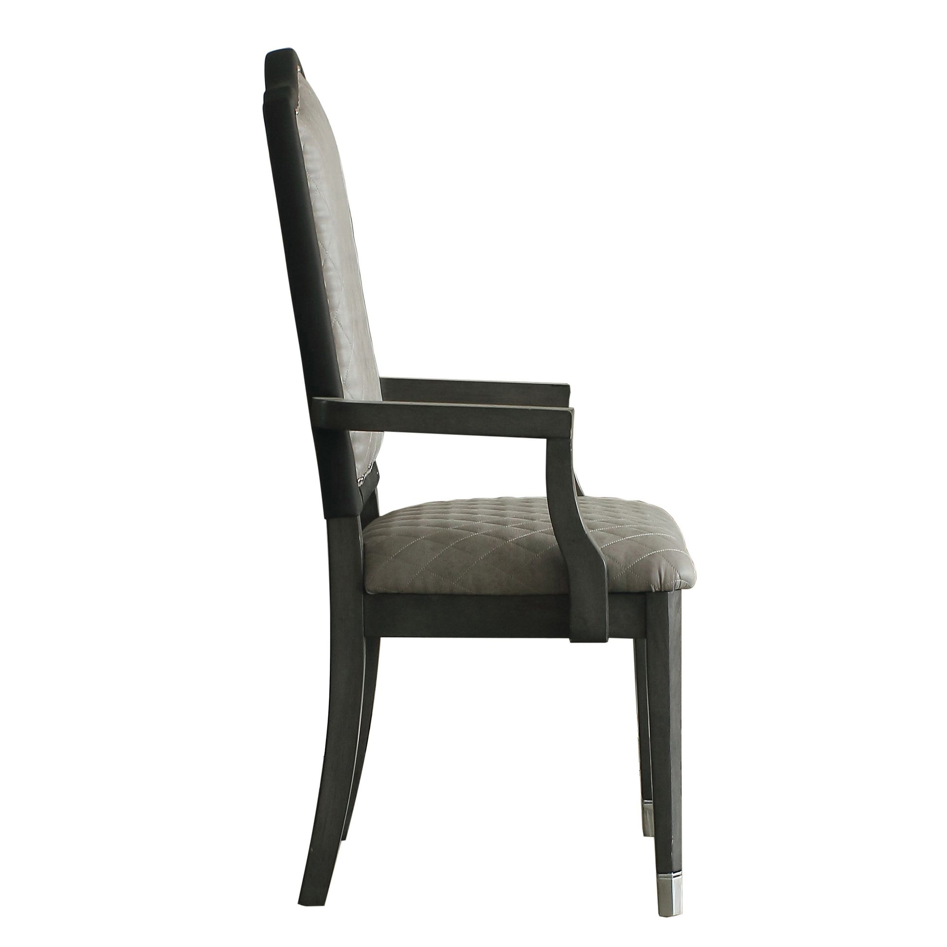Tufted grey upholstered dining chair with dark wood frame and metal accents