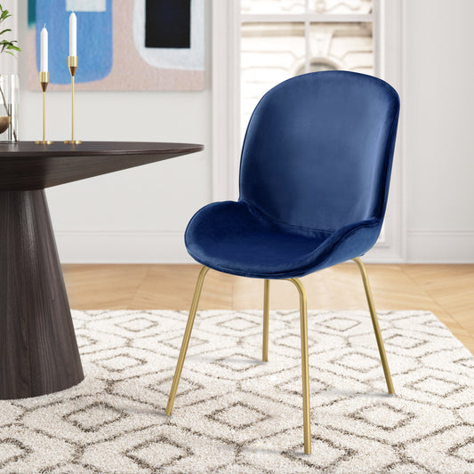 Deep blue velvet dining chair with elegant gold metal legs perfect for modern interiors