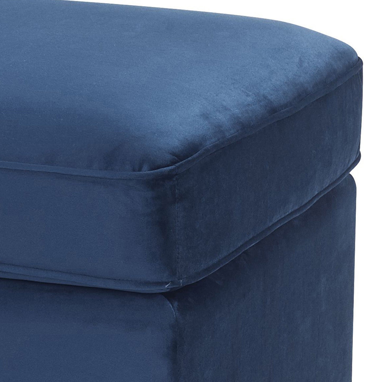 Navy blue velvet ottoman with a plush upholstered top and clean seams