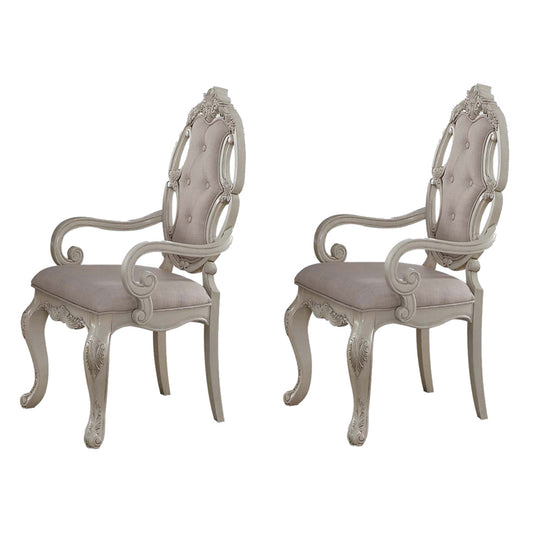Ornate carved wood dining chair with upholstered seat in neutral tone