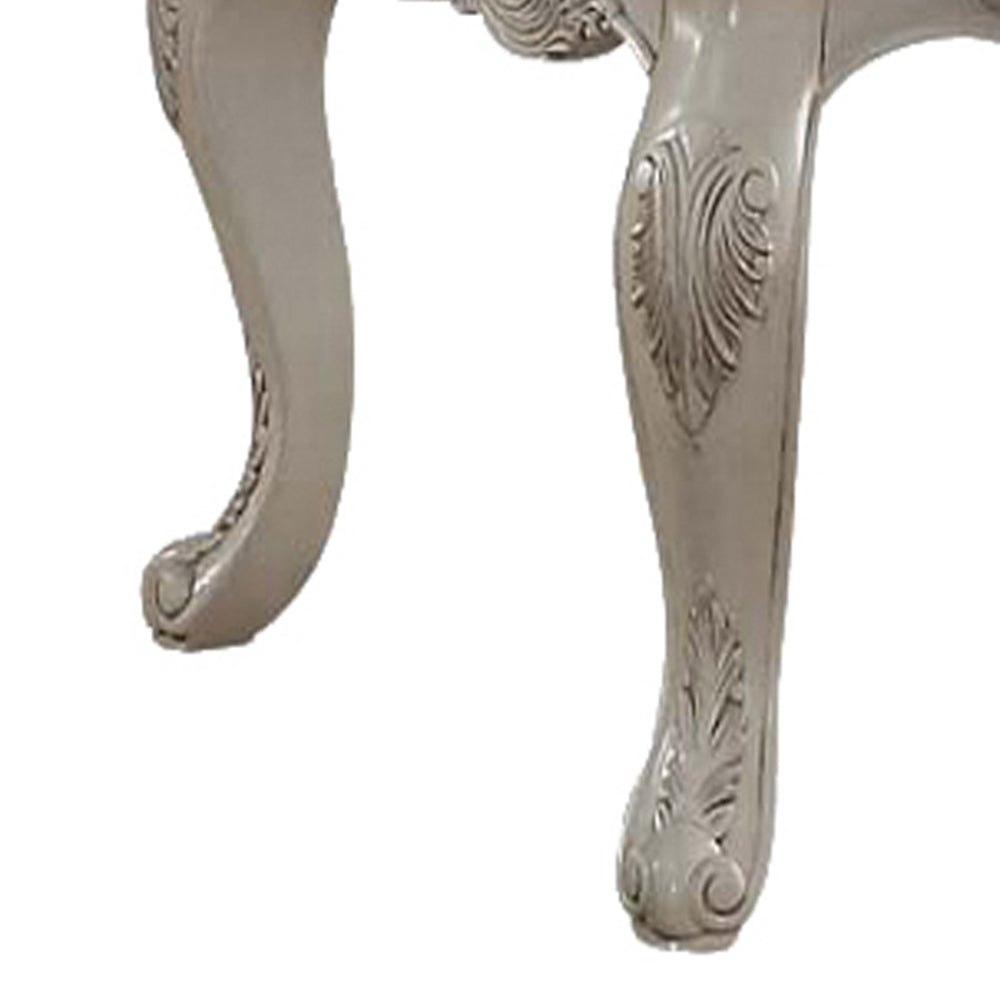 Ornate carved clawfoot table leg in antique white finish
