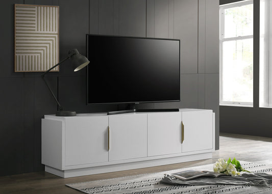 Modern white TV stand with gold handles showcasing a large flatscreen television