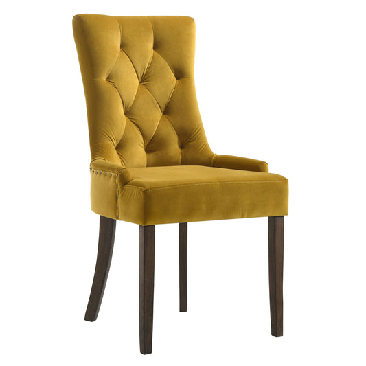 Golden velvet wingback dining chair with diamond tufting and dark wood legs