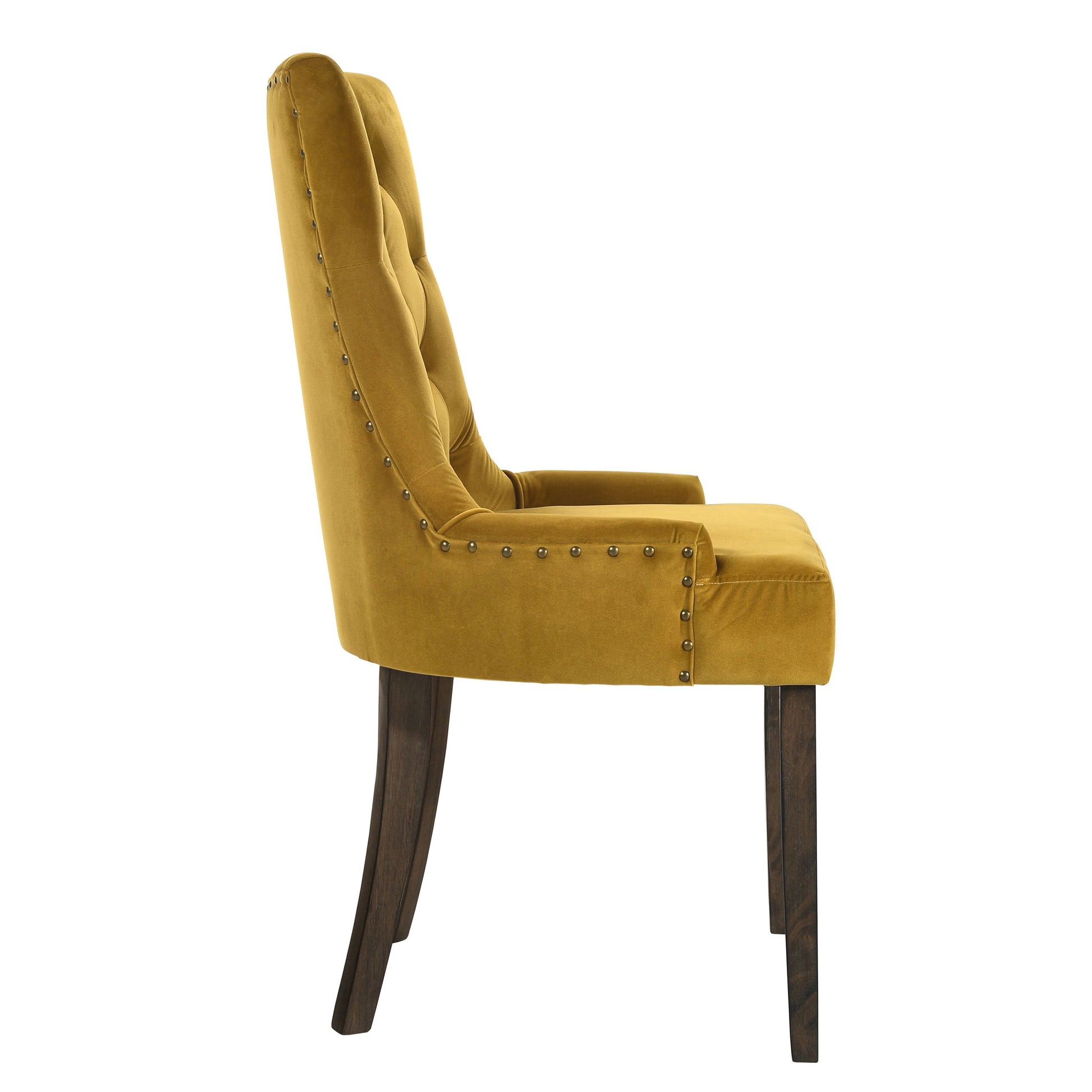 Mustard yellow velvet dining chair with button tufting and antique brass nailhead trim