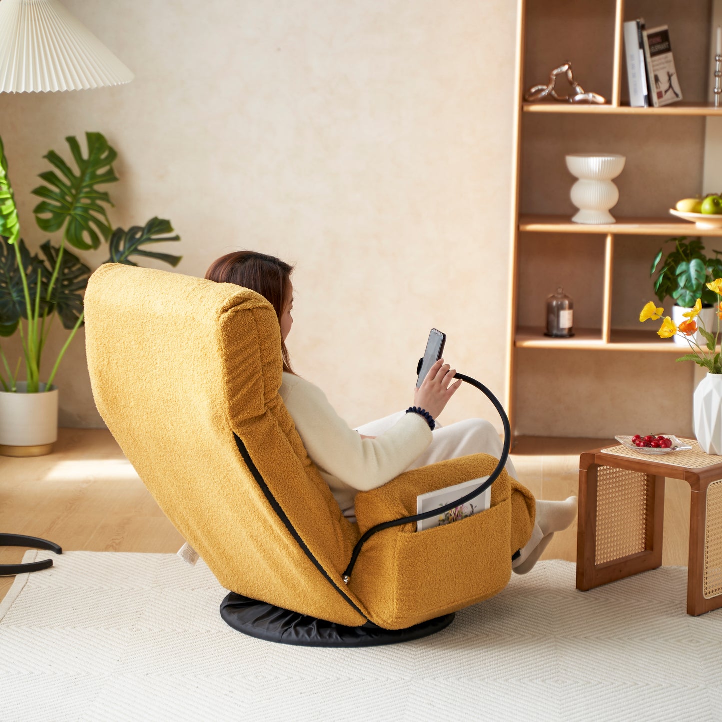 Cozy yellow textured armchair with a builtin phone holder for easy viewing