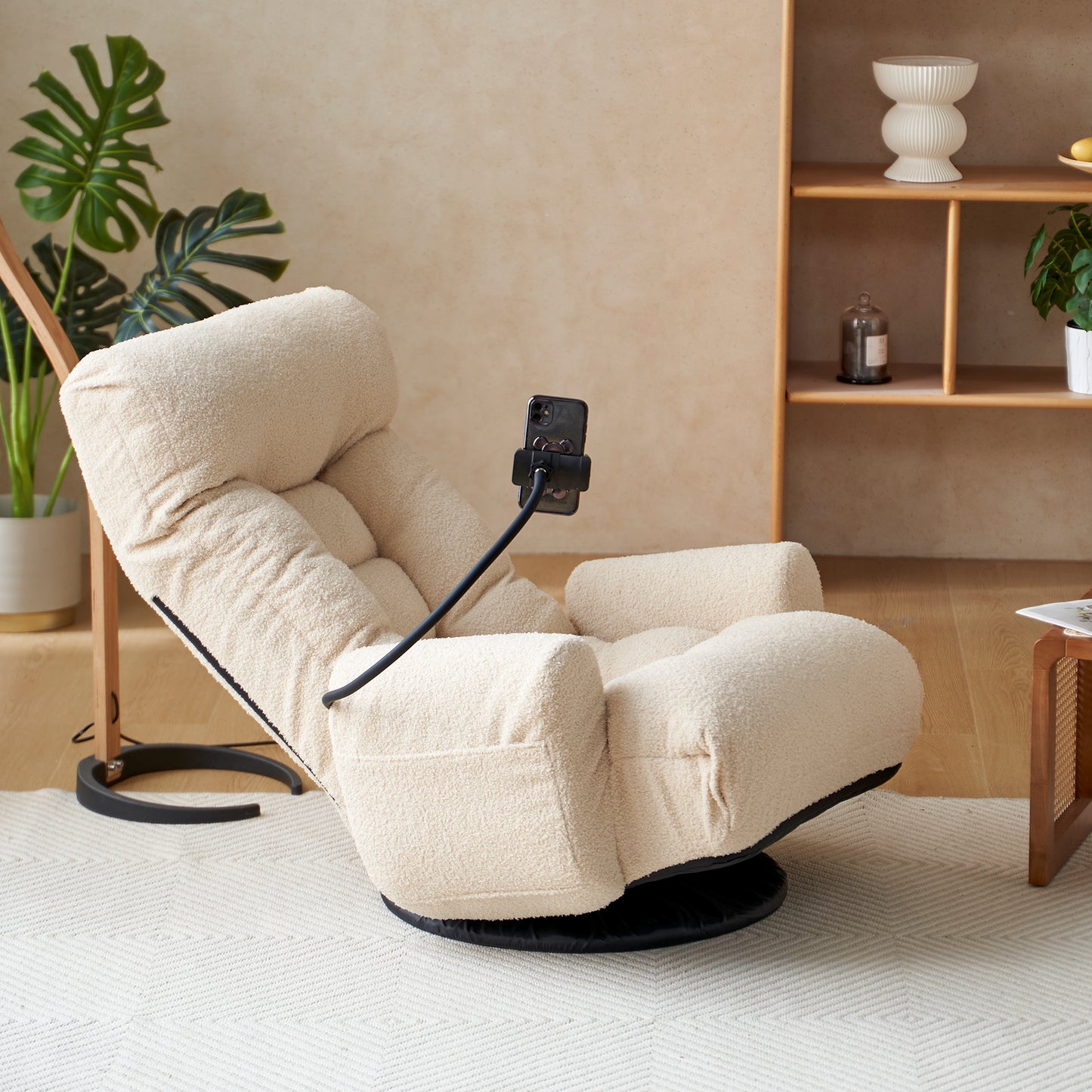 Plush cream swivel accent chair with adjustable phone holder for ultimate relaxation