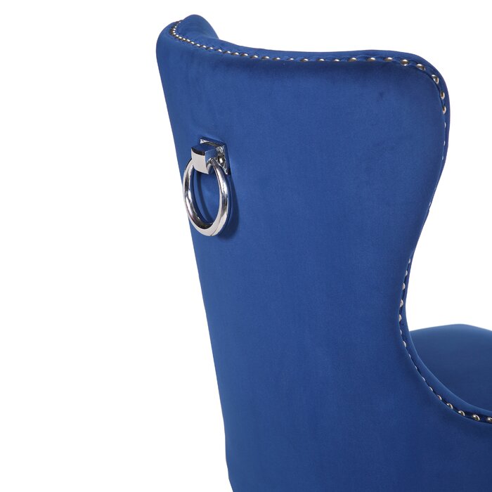 Luxurious royal blue velvet dining chair with polished silver ring pull and stud details
